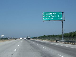 This interchange sequence sign provides the distance to the next three interchanges along northbound California 99: Exit 201, Hammatt Avenue; Exit 203, Winton Avenue; and Exit 204, Collier Avenue.