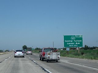 California 165 travels south from this interchange through Hilmar and Los Banos to meet Interstate 5 at Exit 391.