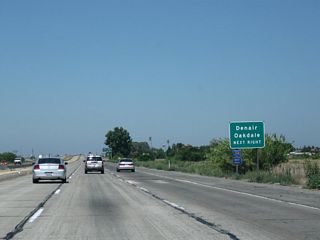 CR J-14 is a fairly long, north-south county route that spans both Stanislaus and San Joaquin Counties. It follows Lander Avenue into downtown Turlock, then proceeds north via Geer Road to California 132, Albers Road to Oakdale, Yosemite Avenue through Oakdale (with a brief overlap via California 120), Twenty-six Mile Road (past Woodward Reservoir), Sonora Road (to Eugene), Milton Road (past California 4 to Milton and Jenny Lind), and Jenny Lind Road (ending at California 26 near Rancho Calaveras).