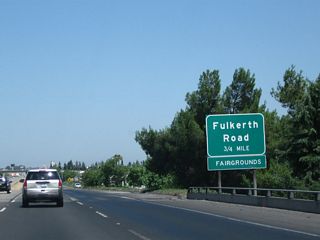 The next exit along California 99 north is Exit 214, Fulkreth Road (0.75 mile). This reflective sign was placed as early as 2003, if not earlier.