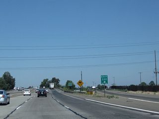 An exit number is posted at the gore point.
