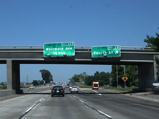 Northbound California 99 reaches Exit 221, Fourth Street. The next exit along northbound is Exit 222, Whitmore Avenue.
