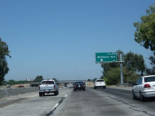 Northbound California 99 reaches Exit 222, Whitmore Avenue. This sign was replaced between 2004 and 2011.