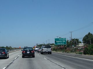 The next two exits along California 99 north are Exit 223A, Hatch Road east and Exit 223B, Hatch Road west. Parallel to Whitmore Avenue, it is the last major east-west arterial before the freeway crosses the Tuolumne River. Only a few north-south roads span the river in the vicinity of Modesto, including California 99, California 99 Business (Ninth Street), Mitchell Road and Stanislaus County Route J-7 (Santa Fe Avenue).