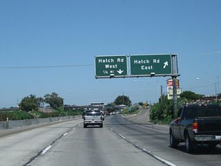 Northbound California 99 reaches Exit 223A, Hatch Road east. The second exit is Exit 223B, Hatch Road west.