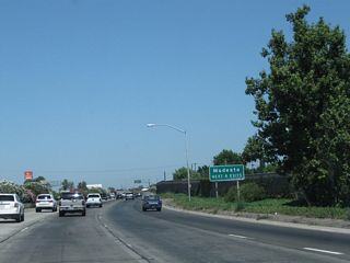The succeeding eight exits of California 99 north all serve the city of Modesto.