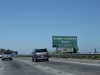 The next exit along California 99 north is Exit 225A, Crows Landing Road (0.50 mile). Crows Landing Road roughly parallels the proposed southwesterly extension of California 108. It travels south and then west across the San Joaquin River, meeting Interstate 5 near Crows Landing. There are no current plans to extend California 108 southwest via Crows Landing Road, but the extension remains in the legislative definition for California 108.