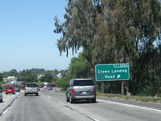 There are two signs consecutive that indicate the exit ramp for Crows Landing Road as in this and the previous photo. Crows Landing Road also leads northeast into Modesto, connecting with the business route (South Ninth Street).
