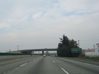 The next exit along northbound California 99 is Exit 229, Carpenter Road and Briggsmore Avenue to California 99 Business (Ninth Street) south. We have left the core of Modesto and are now in the suburban periphery.