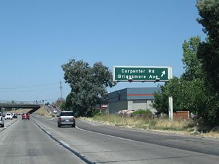 Northbound California 99 meets Exit 229, Carpenter Road and Briggsmore Avenue to California 99 Business (Ninth Street) south in northwestern Modesto.