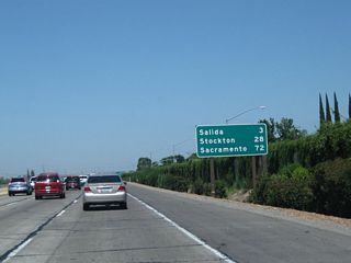 This mileage sign along California 99 north provides the distance to Salida (three miles), Stockton (28 miles), and Sacramento (72 miles).