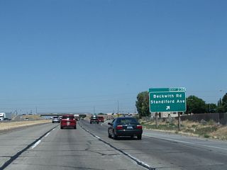 Northbound California 99 meets Exit 230, Beckwith Road / Standiford Avenue. This exit features a large shopping mall and plenty of services.