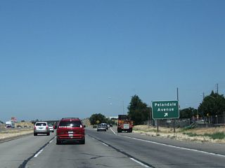 Northbound California 99 reaches Exit 232, Pelandale Avenue in Salida.