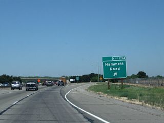 Northbound California 99 meets Exit 234, Hammett Road. This is the last exit in Stanislaus County; California 99 next enters San Joaquin County and the populous Stockton area.