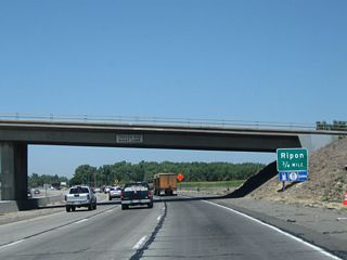 Passing under the Hammett Road overpass, the next exit along California 99 north is Exit 236, Main Street to the city of Ripon in San Joaquin County.