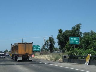 Northbound California 99 enters the city of Ripon ("The Jewel of the Valley") and approaches Exit 236, Main Street, which essentially serves as a business spur from California 99 into downtown Ripon. The city of Ripon had a population of 14,297 as of the 2010 Census and was incorporated on November 27, 1945.