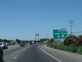 Northbound California 99 meets Exit 237B, San Joaquin County Route J-5 (Jack Tone Road). Most motorist services (gas, food) are available at this interchange in north Ripon.