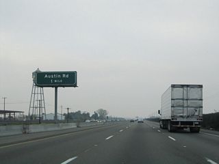 The next exit along California 99 north is Exit 240, Austin Road (one mile).