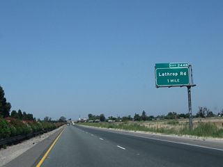 The next exit along California 99 north is Exit 244B, Lathrop Road (one mile). Exit 244A to Main Street south is not accessible from northbound California 99.