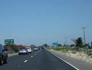 Arch Airport Road travels west to Stockton Metropolitan Airport, and Arch Road travels east to Austin Road (which connects to Mariposa Road).