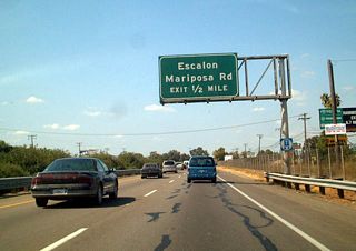 The next exit along northbound California 99 is Exit 252A, California 99 Business and San Joaquin County Route J-7 (Mariposa Road). San Joaquin County Route J-7 and California 99 Business lead northwest into Stockton; San Joaquin County Route J-7 leads southeast toward Escalon, Riverbank, and Empire. Use California 99 Business (Mariposa Road) north to California 4 Business west.