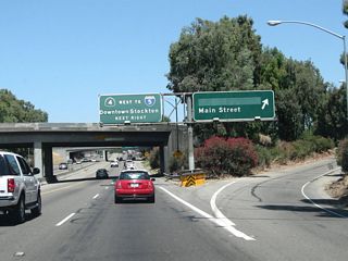 Northbound California 99 reaches Exit 253, Main Street. The following off-ramp is Exit 254A, California 4 (Crosstown Freeway) west to Antioch and Concord. If California 99 is upgraded into  Interstate 9, that route may turn west onto California 4 to end at Interstate 5.