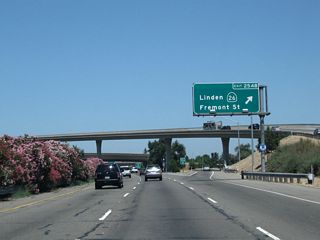 Immediately thereafter, California 99 north meets Exit 254B, California 26 (Fremont Street) east. This is the first two exits that connect to California 26 and Fremont Street.
