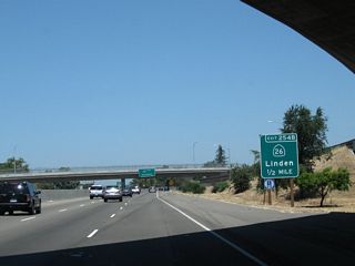 The next exit along California 99 north is Exit 254C, Fremont Street west and California 26 (Fremont Street) east (again). California 26 was known as California 8 until 1964, when it was renumbered to avoid route number duplication with newly designated Interstate 8 in Southern California.
