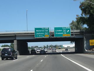 Northbound California 99 reaches Exit 254C, Fremont Street west and California 26 (Fremont Street) east. The next exit along California 99 north is Exit 255, California 88 (Waterloo Road).