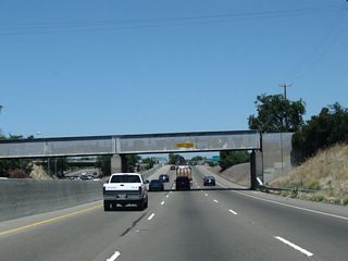 California 99 passes under a railroad bridge shortly thereafter.