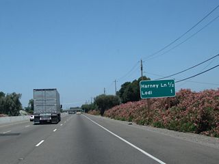 The next two exits along California 99 north are Exit 263, Harney Lane and Exit 264A, California 99 Business (Cherokee Lane) north to Lodi.