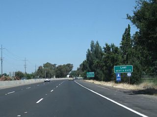 The next four exits along northbound California 99 serve the city of Lodi: Exit 264A, California 99 Business (Cherokee Lane) north; Exit 264B, California 12 (Kettleman Lane) west; Exit 266, California 12 (Victor Road) east; and Exit 267A, Turner Road.