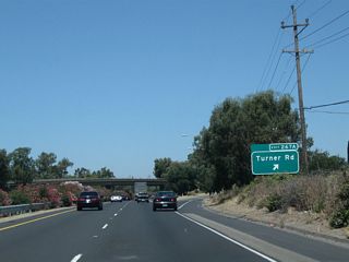 Northbound California 99 meets Exit 267A, Turner Road.