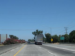 Northbound California 99 meets Exit 267B, Frontage Road. This exit is located immediately after the Mokelumne River bridge.