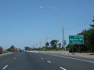 The next exit along California 99 north is Exit 270, San Joaquin County Route J-12 (Peltier Road).