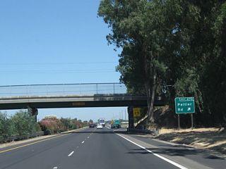Northbound California 99 reaches Exit 270, San Joaquin County Route J-12 (Peltier Road). CR J-12 travels about 20 miles, starting at San Joaquin County Route J-8 (Thornton Road) and traveling east via Peltier Road, Tully Road, Jahant Road, Mackville Road, and Collier Road to end at California 88 northeast of Clements.