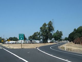 The off-ramp to Collier Road uses a section of frontage road before connecting to Collier Road itself.