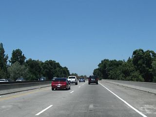 California 99 crosses Dry Creek and will soon leave San Joaquin County and enter Sacramento County.