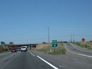 This is the gore point for Exit 274B, C Street west to Galt and Boessow Road east.