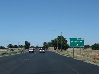 Northbound California 99 meets Exit 281, Dillard Road. After this exit, the freeway crosses the Consumnes River.