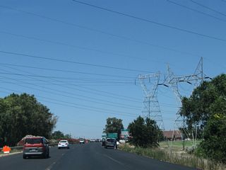 More power lines cross over California 99 just shy of Exit 284.