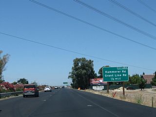 The next exit along California 99 north is Exit 284, Sacramento County Route E-2 (Grant Line Road) northeast and Kammerer Road west (one-half mile). Sacramento County Route E-2 begins its northerly journey here; it switches from Grant Line Road to Sunrise Boulevard near its junction with California 16 and then follows Sunrise Boulevard on its path through the suburbs east of Sacramento.