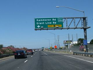 The right two lanes of California 99 north connect to Exit 284, Sacramento County Route E-2 (Grant Line Road) northeast and Kammerer Road west. This area was substantially reconfigured between 2003 and 2011.
