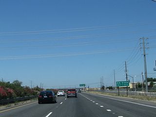 The next five exits from California 99 north serve the city of Elk Grove: Exit 284, Sacramento County Route E-2 (Grant Line Road) northeast and Kammerer Road west; Exit 286, Sacramento County Route E-12 (Elk Grove Boulevard); Exit 287, Bond Road and Laguna Boulevard; Exit 288, Sheldon Road; and Exit 289, Consumnes River Boulevard and Calvine Road.