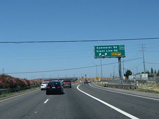 Northbound California 99 meets Exit 284, Sacramento County Route E-2 (Grant Line Road) north and Kammerer Road west. Another, separate road also known as Grant Line Road is located several miles southwest of here; it has an exit along Interstate 205 near Tracy.
