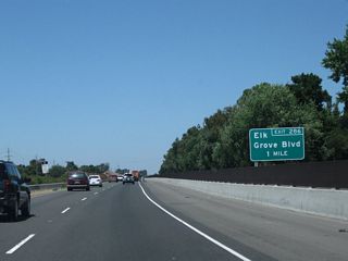 California 99 north approaches Exit 286, Sacramento County Route E-12 (Elk Grove Boulevard) (one mile).