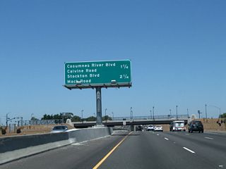 This mileage sign along northbound California 99 provides the distance to the next two exits: Exit 289, Consumnes River Boulevard and Calvine Road and Exit 291, Mack Road and Stockton Boulevard.