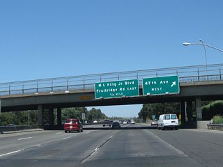 Northbound California 99 meets Exit 294B, 47th Avenue West.