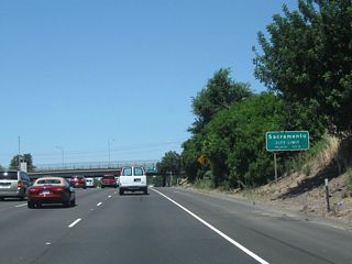 California 99 enters the city of Sacramento, the capital of the state of California and the seat of Sacramento County. Located at the crossroads of Interstate 5, U.S. 50, Interstate 80, and California 99, the city owes its origins to its location at the confluence of the Sacramento River and American River. Sacramento had a population of 466,488 as of the 2010 Census and was incorporated on February 27, 1850. Sitting at an elevation of about 25 feet, Sacramento sees rainy winters and dry summers with an average precipitation of 17.93 inches annually. California 99 will enter the capital city from the southeast and merge with Business Loop I-80 (Capital City Freeway) and U.S. 50 at the WX-29/30 Interchange.