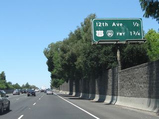 This mileage sign provides the distance to the next four exits along California 99 north starting with Exit 297 for 12th Avenue.